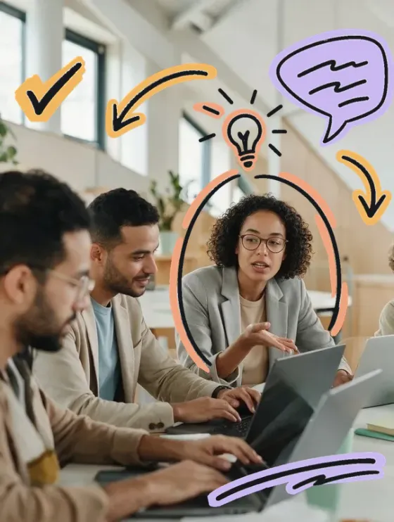 Un atelier de formation à l’IA, ordinateurs ouverts autour d’une table